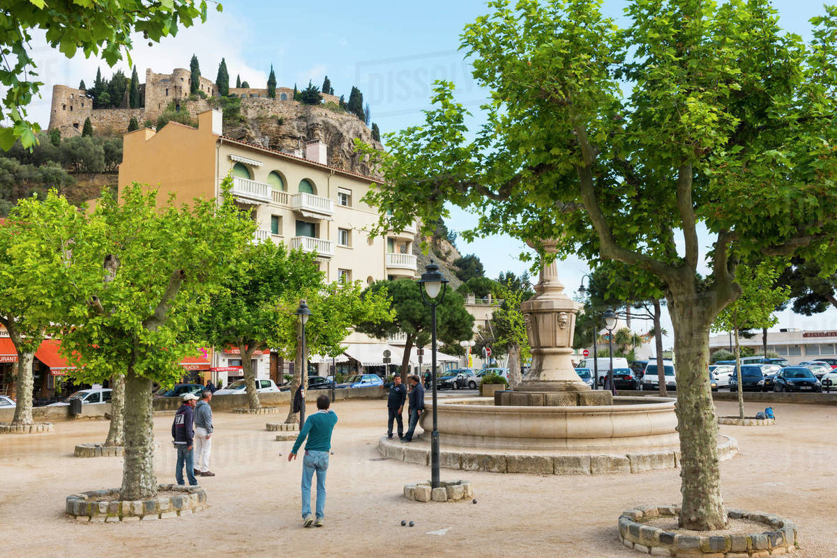 Playing boules in Cassis harbour, Cassis, Bouches du Rhone, Provence, Provence-Alpes-Cote d'Azur, France, Europe Royalty-free stock photo