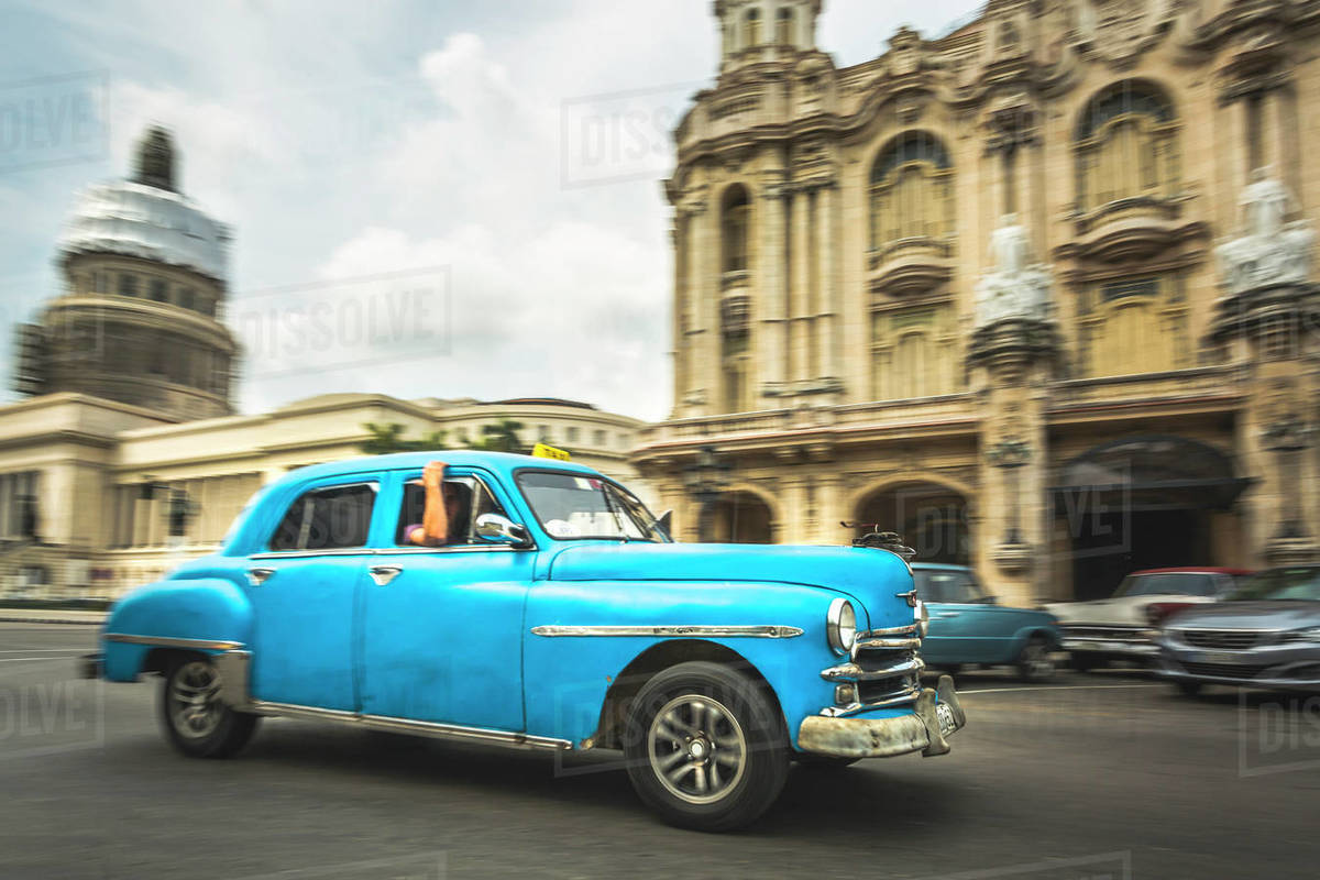 Turquoise American classic car taxi outside El Capitolio in Havana, La Habana, Cuba, West Indies, Caribbean, Central America Royalty-free stock photo