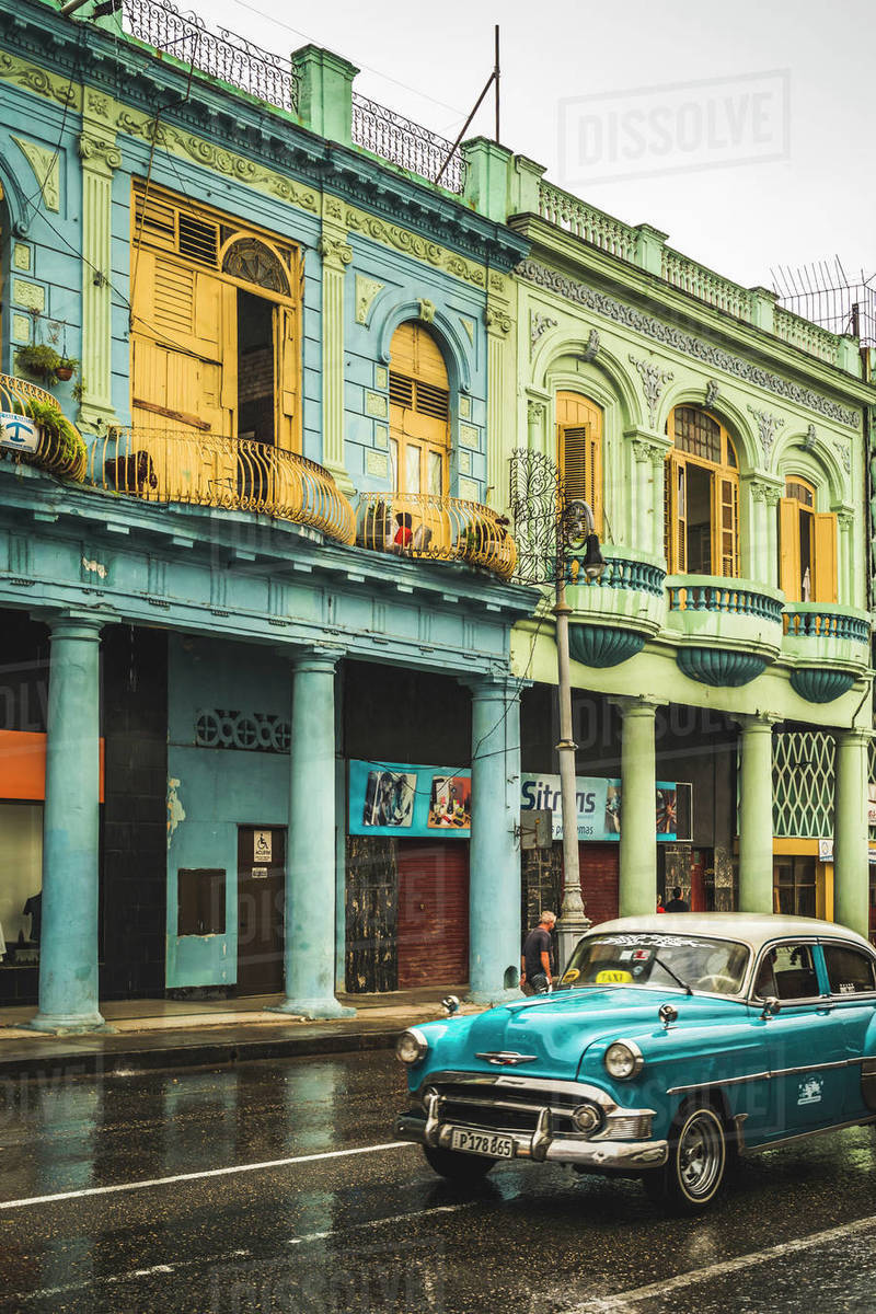 Turquoise vintage taxi in the rain, La Habana (Havana), Cuba, West Indies, Caribbean, Central America Royalty-free stock photo