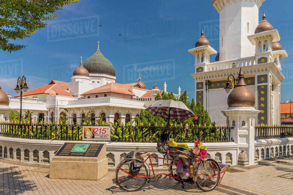 A local rickshaw (tuk tuk) outside Kapitan Keling Mosque, George Town, Penang Island, Malaysia, Southeast Asia, Asia Rights-managed stock photo