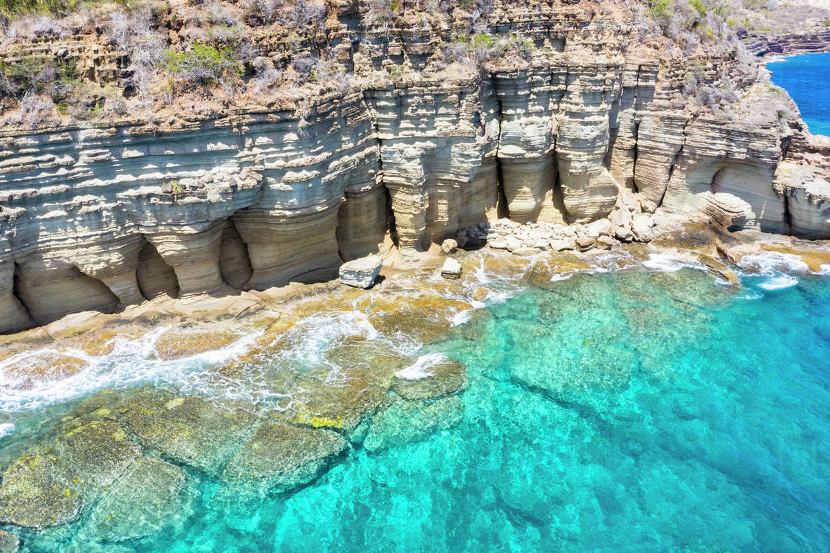 White limestone cliffs Pillar of Hercules washed by Caribbean Sea