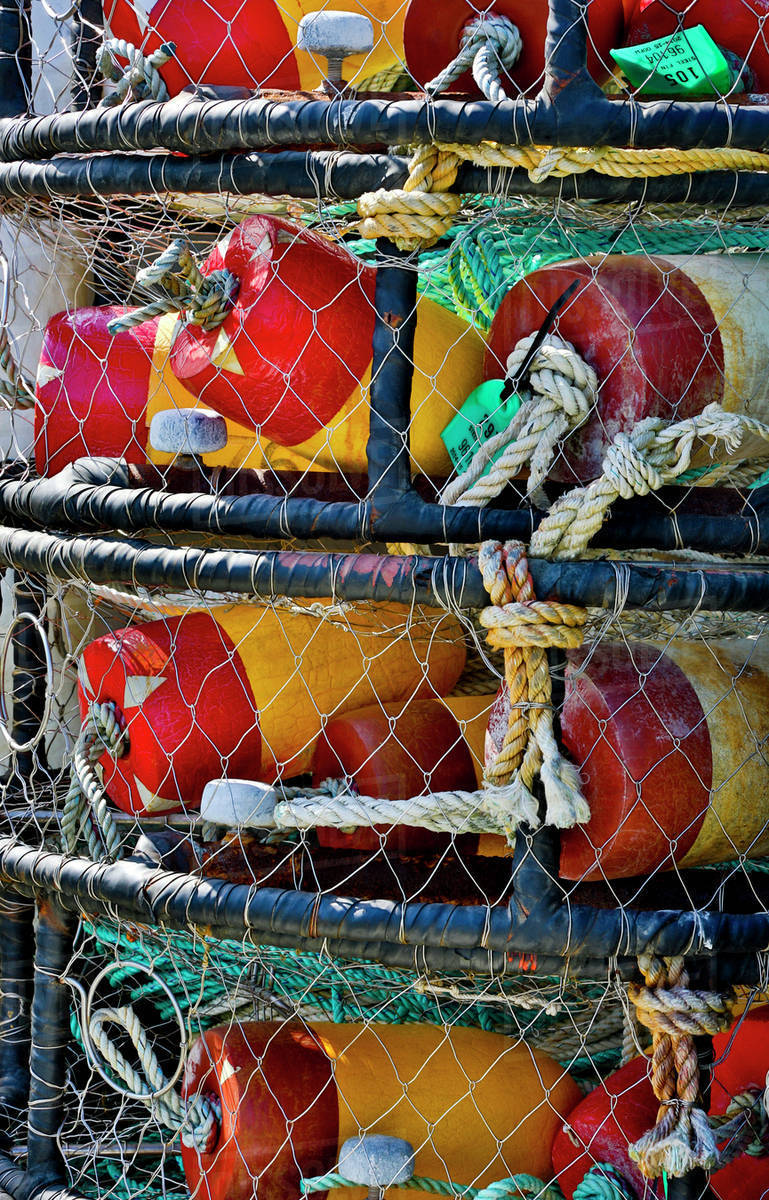 USA, Oregon, Garibaldi. Stacked crab pots on dock. Stock Photo Dissolve