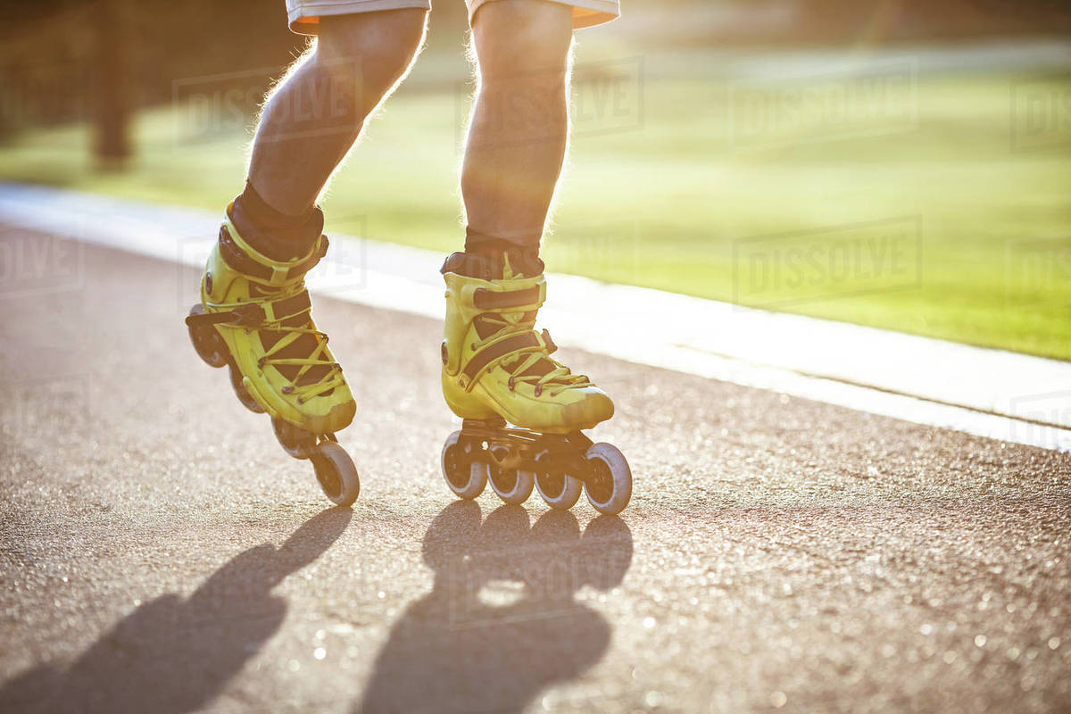 Man rollerblading on the asphalt Stock Photo Dissolve