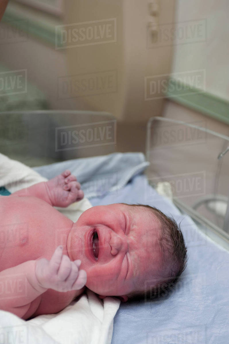 Newborn baby girl crying - Royalty-free Stock Photo | Dissolve