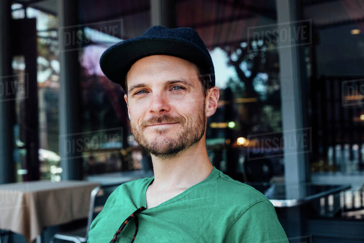 Man outside cafe, Long Beach, California, US Stock Photo Dissolve