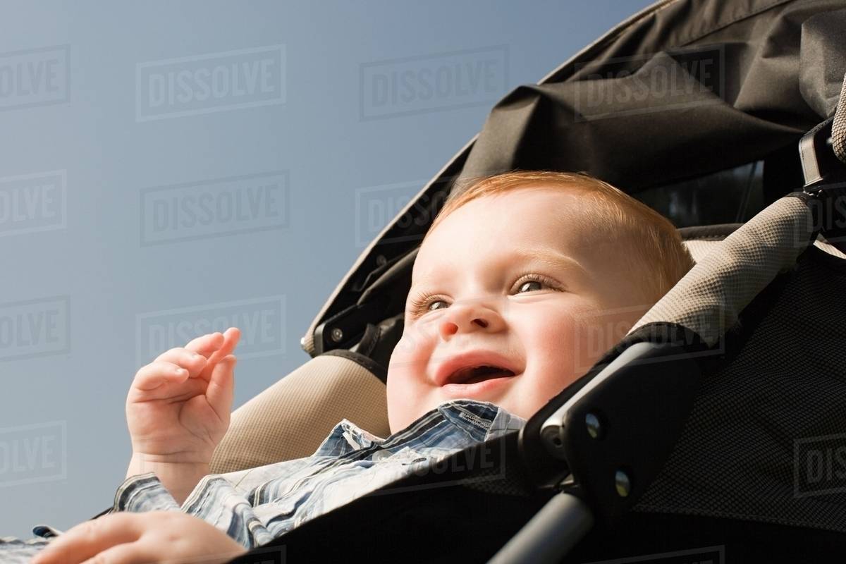 Baby in push chair Stock Photo Dissolve