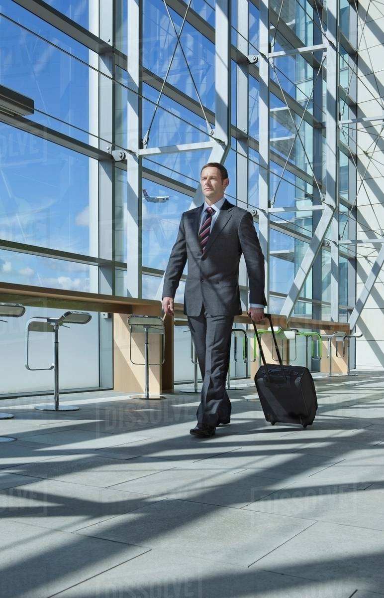 Businessman in airport Stock Photo Dissolve