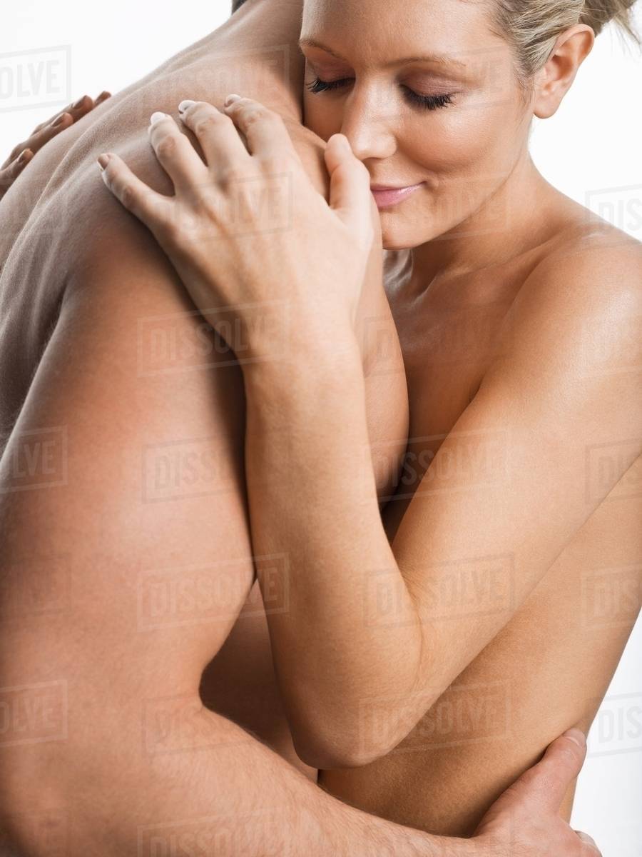 Nude couple hugging - Stock Photo - Dissolve