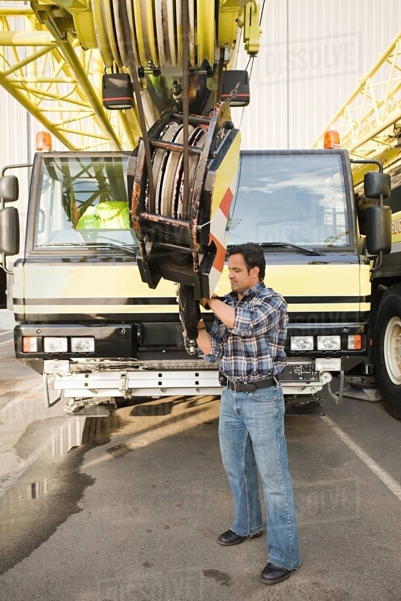 Man with crane truck - Royalty-free Stock Photo | Dissolve