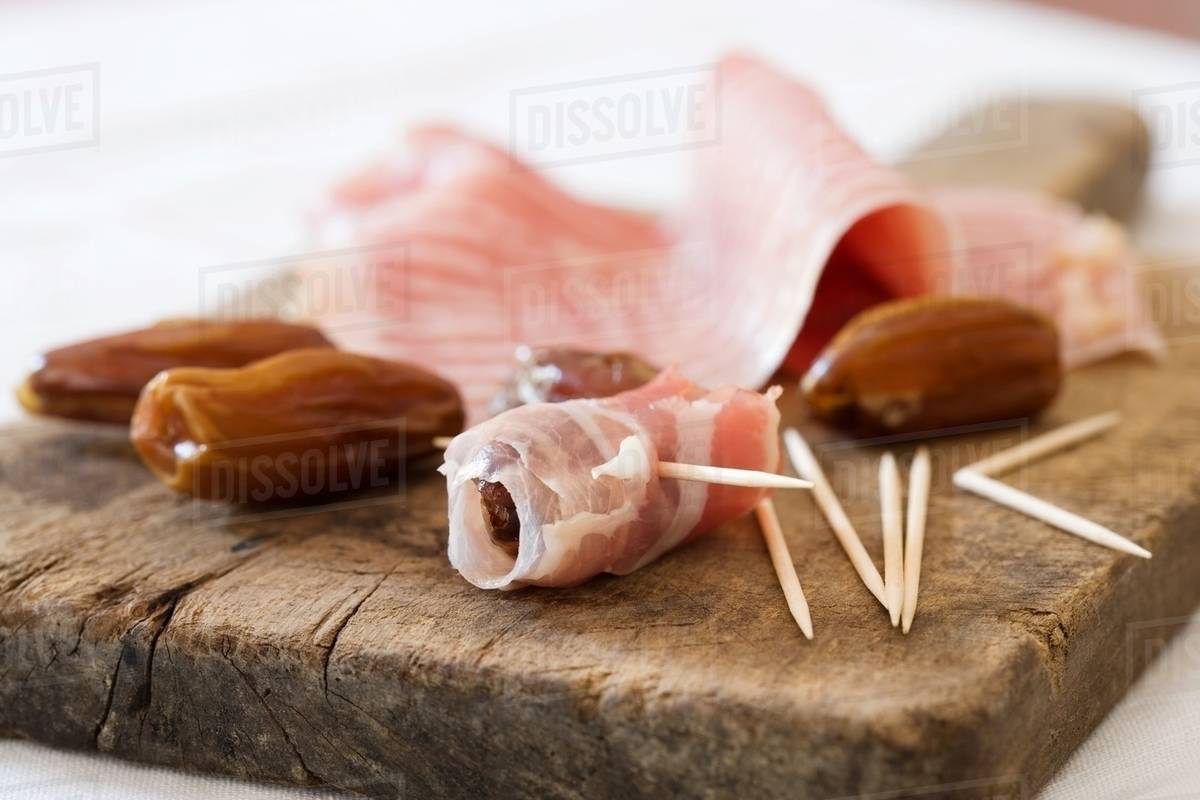 Parma ham and dates Stock Photo Dissolve