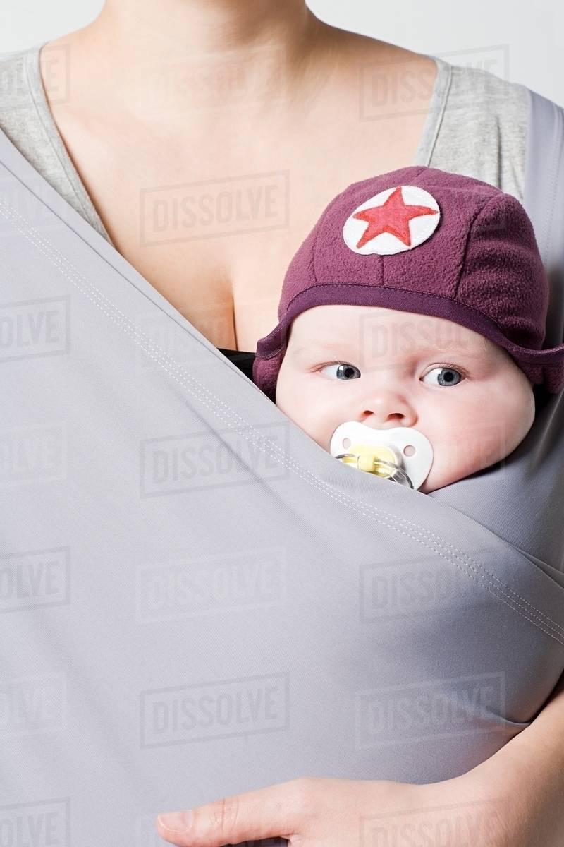 A baby in a baby sling Stock Photo Dissolve