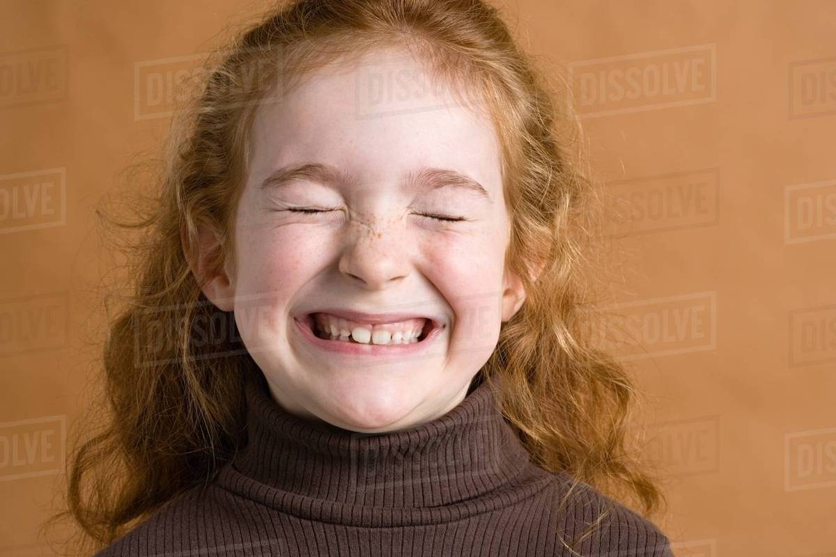 Girl smiling with eyes closed Stock Photo Dissolve