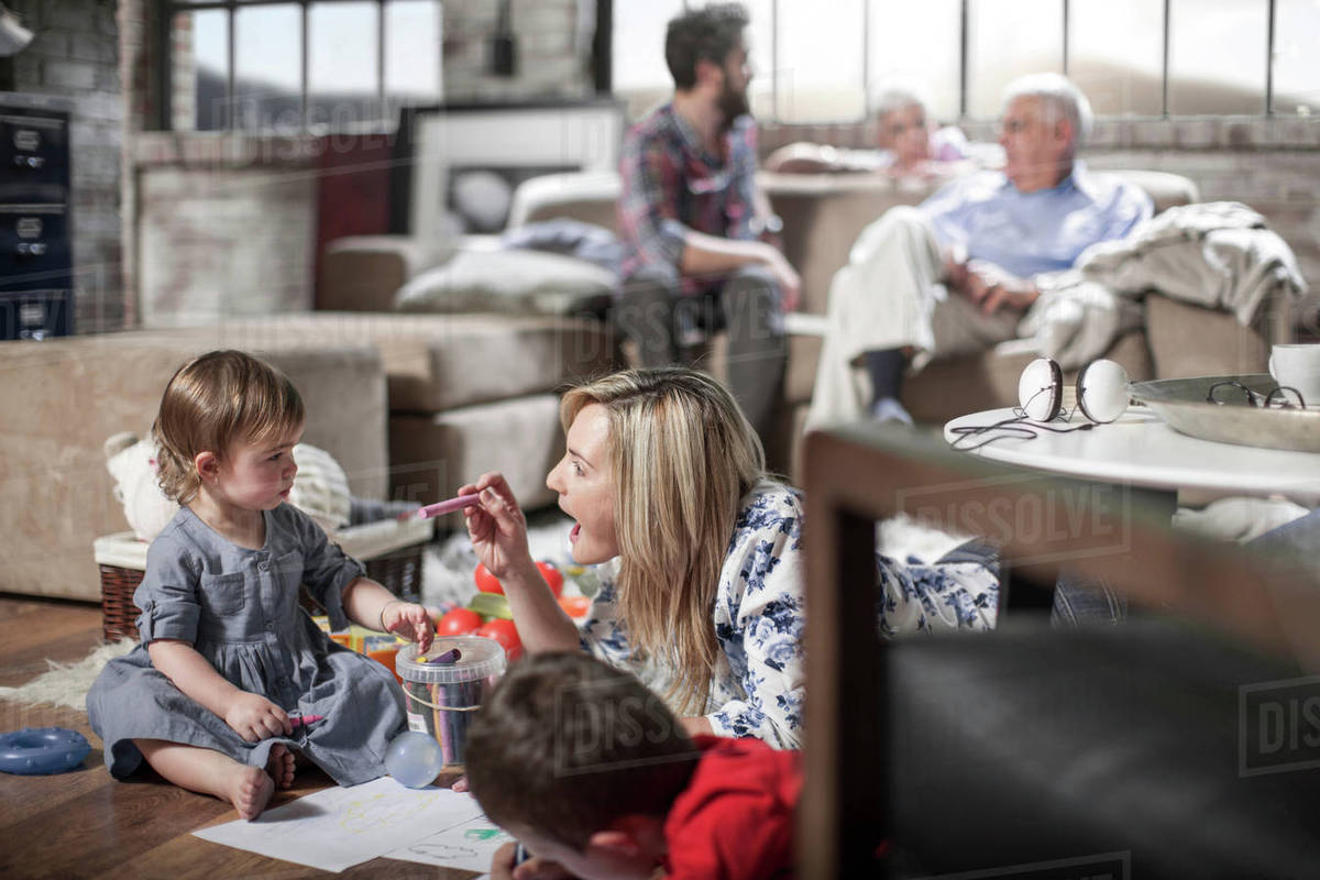 Mother And Children Drawing At Home Stock Photo Dissolve