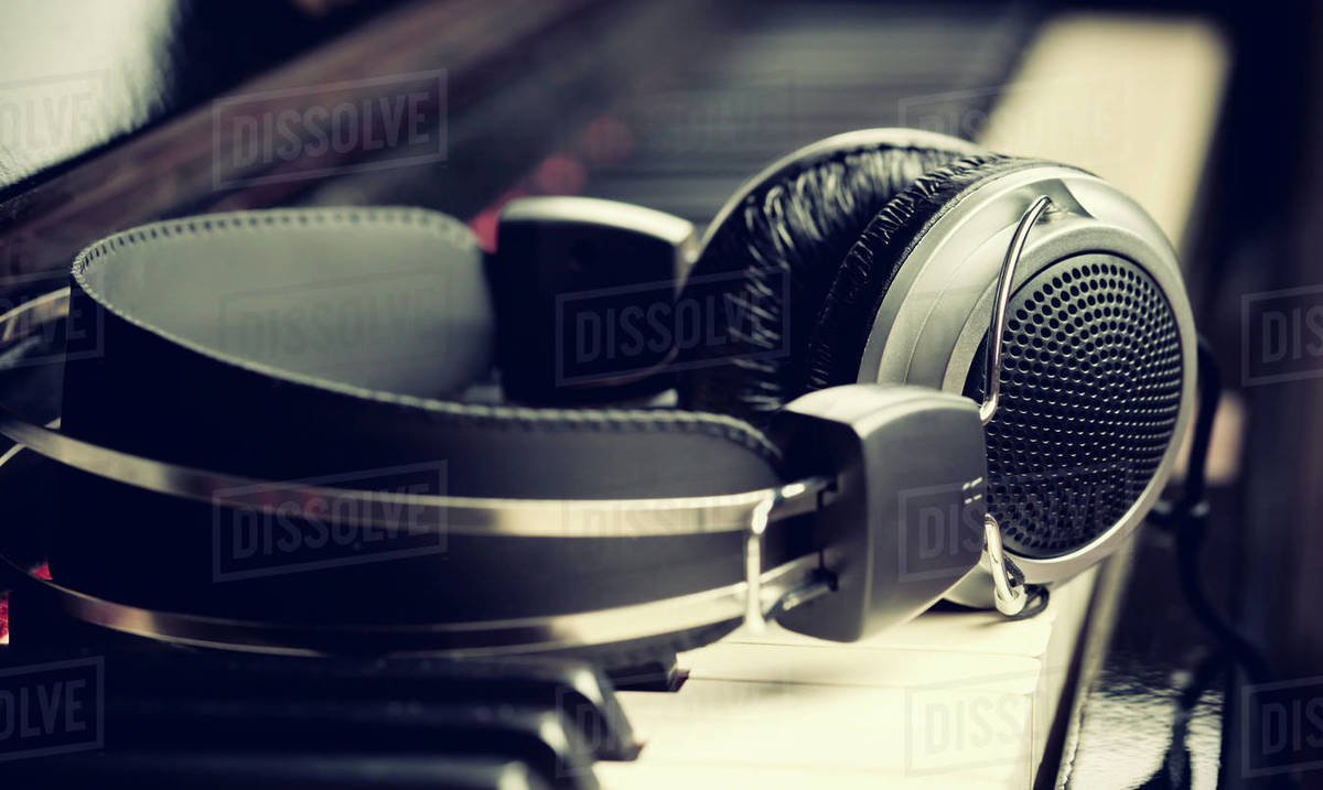 Piano keyboard with headphones for music Stock Photo Dissolve