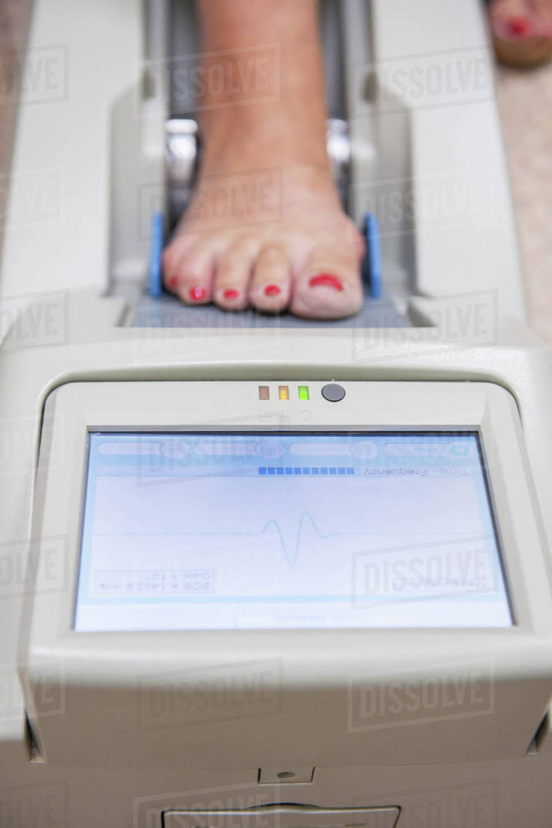 Checking osteoporosis on modern electronic device Stock Photo Dissolve