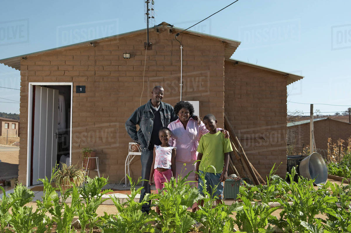 RDP house with family portrait outside, Johannesburg, Gauteng, South
