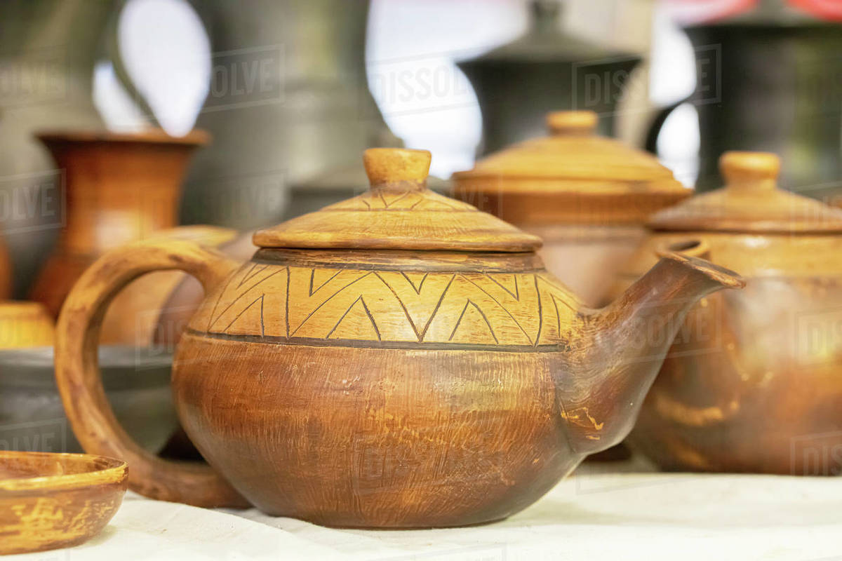 Pottery. Clay teapot. Stock Photo Dissolve