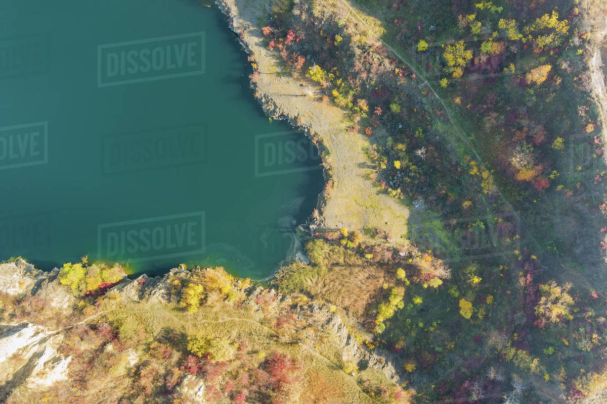 Artificial lake in a quarry with turquoise background of the clearwater
