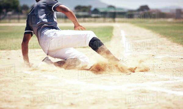 Baseball player, running slide and man on a base at a game with ...