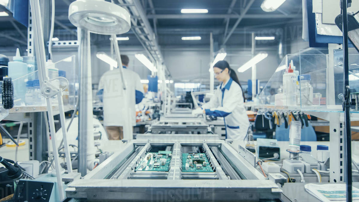 Shot of an Electronics Factory Workers Assembling Circuit Boards by