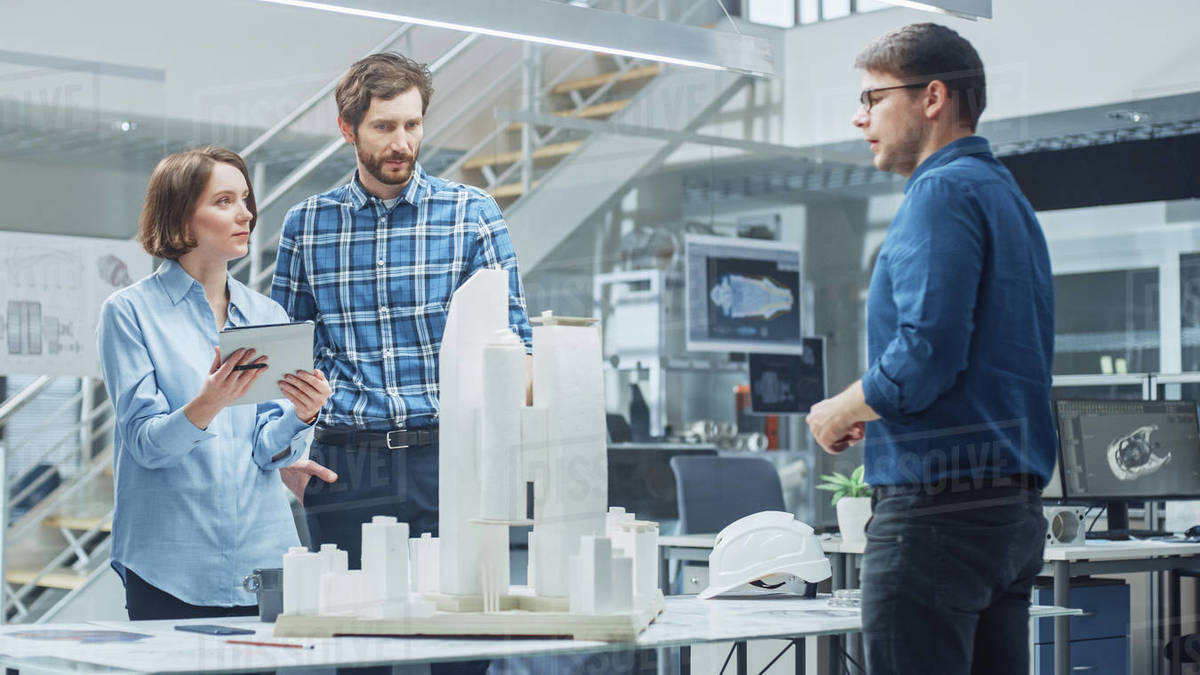 In Architectural Bureau: Team of Architects and Engineers Working on a ...