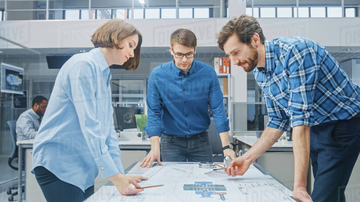 In the Industrial Engineering Facility Female Designer Works with