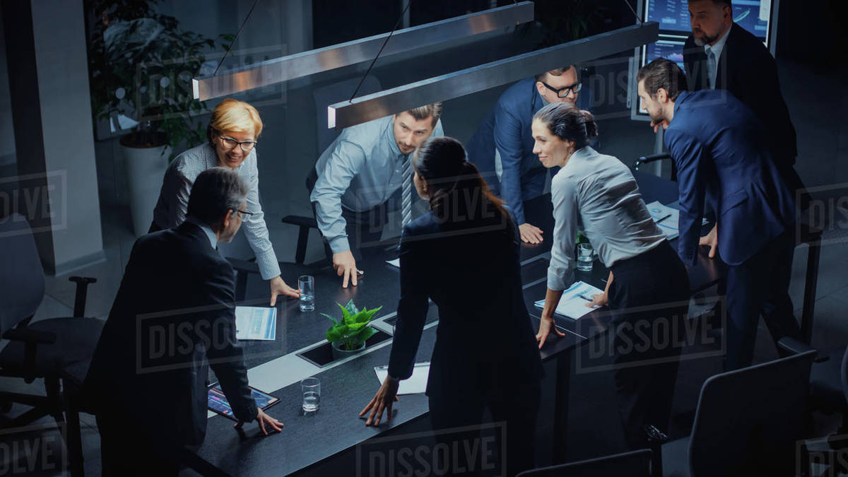 In the Dark Corporate Meeting Room Diverse Group of Executives