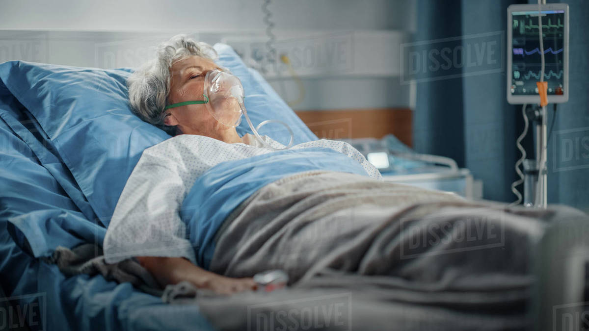 Elderly Woman Wearing Oxygen Mask Sleeping in Bed, Fully Recovering