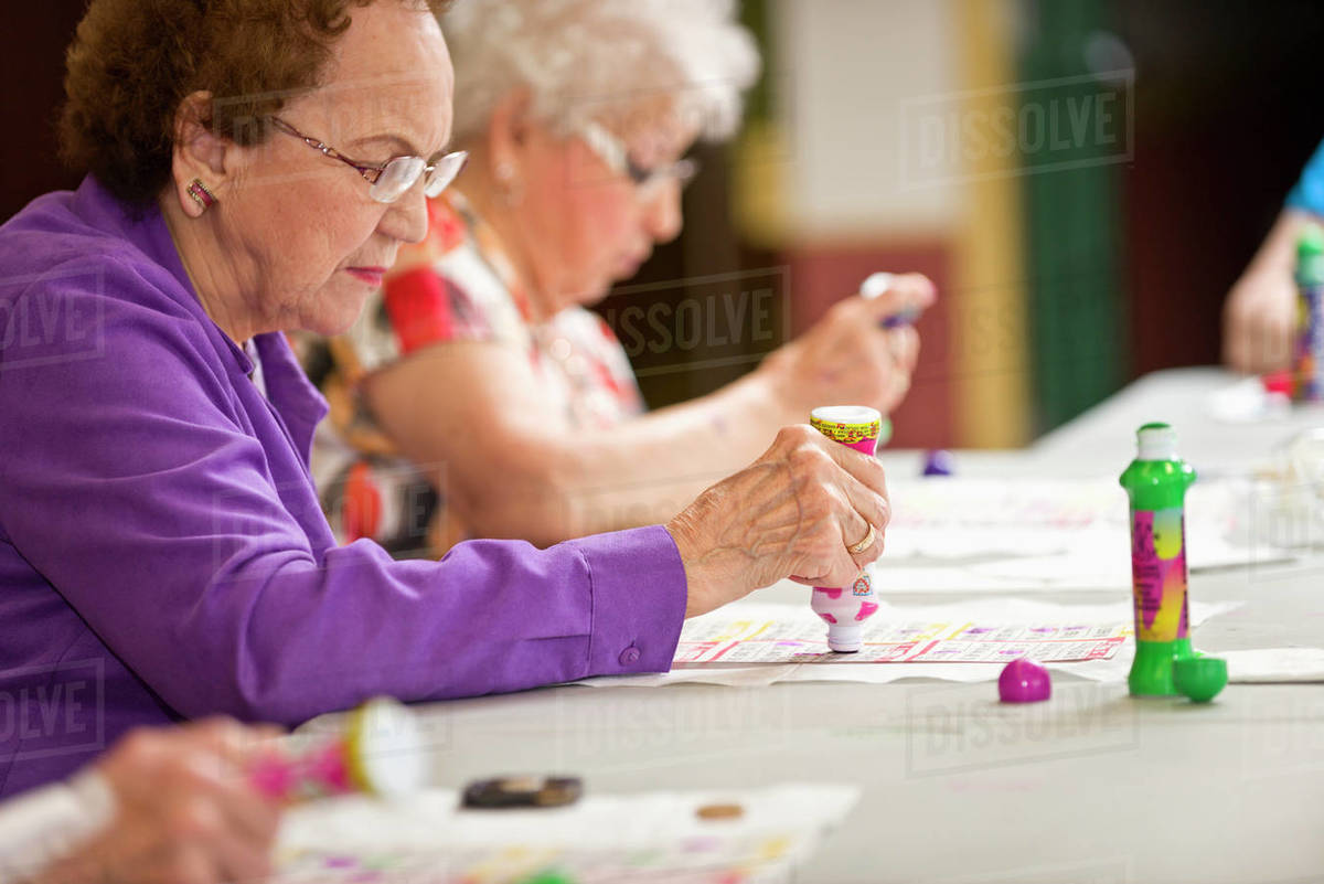 Senior Citizens Playing Bingo - Stock Photo - Dissolve