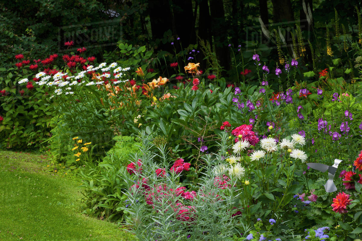 Flower garden; Knowlton, Quebec, Canada Stock Photo Dissolve