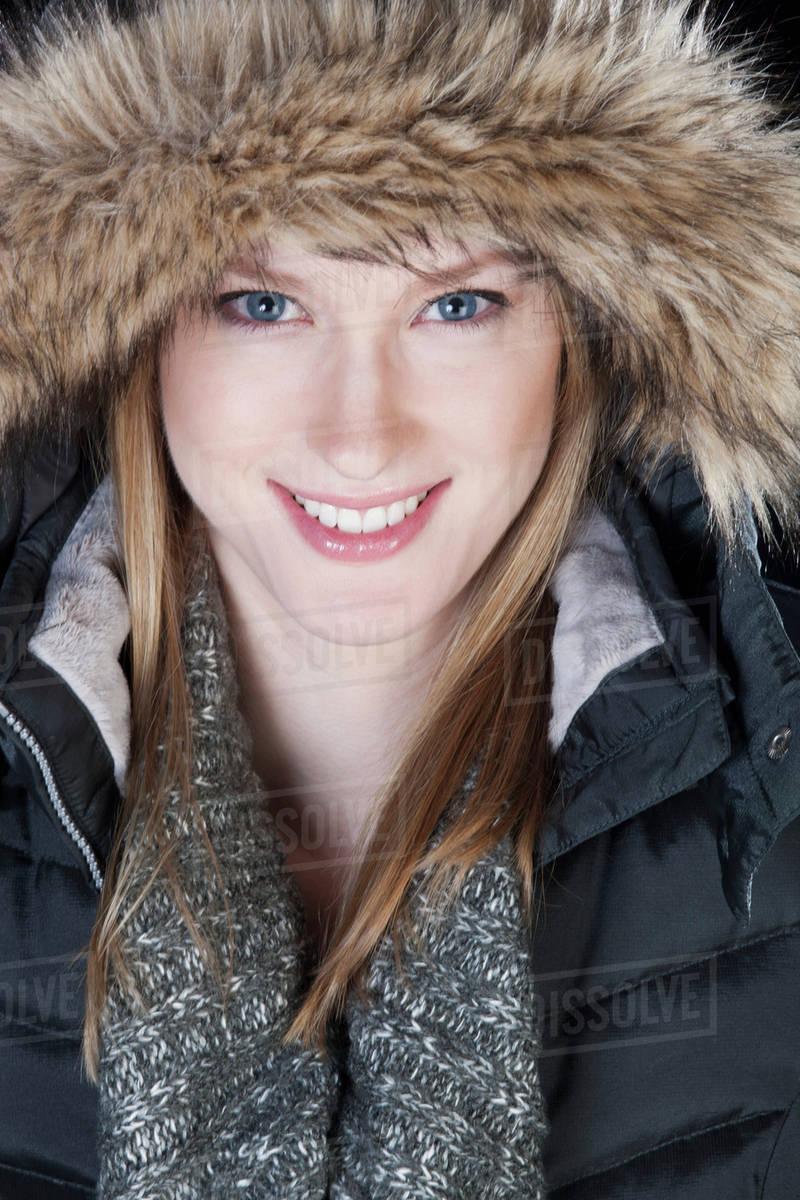 Young woman in a fur trimmed hood and winter coat; Edmonton, Alberta