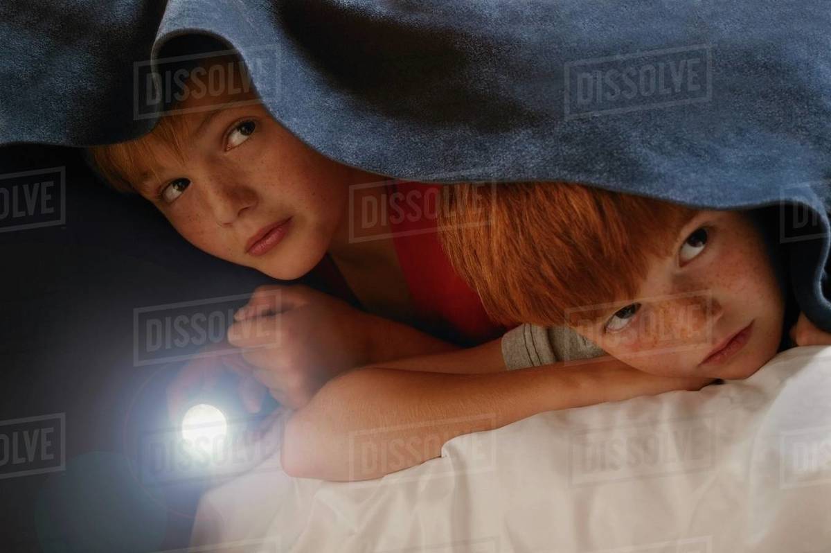 Children Hide Under Blanket Stock Photo Dissolve