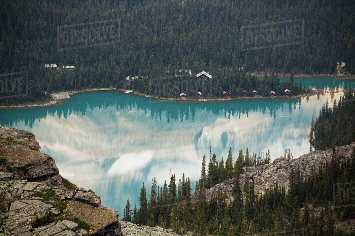 Alpine Lake Framed By Sline And Mountain Cliffs Reflecting Alpine Lake Framed By Sline And Mountain Cliffs Reflecting The Mountains British Columbia Canada