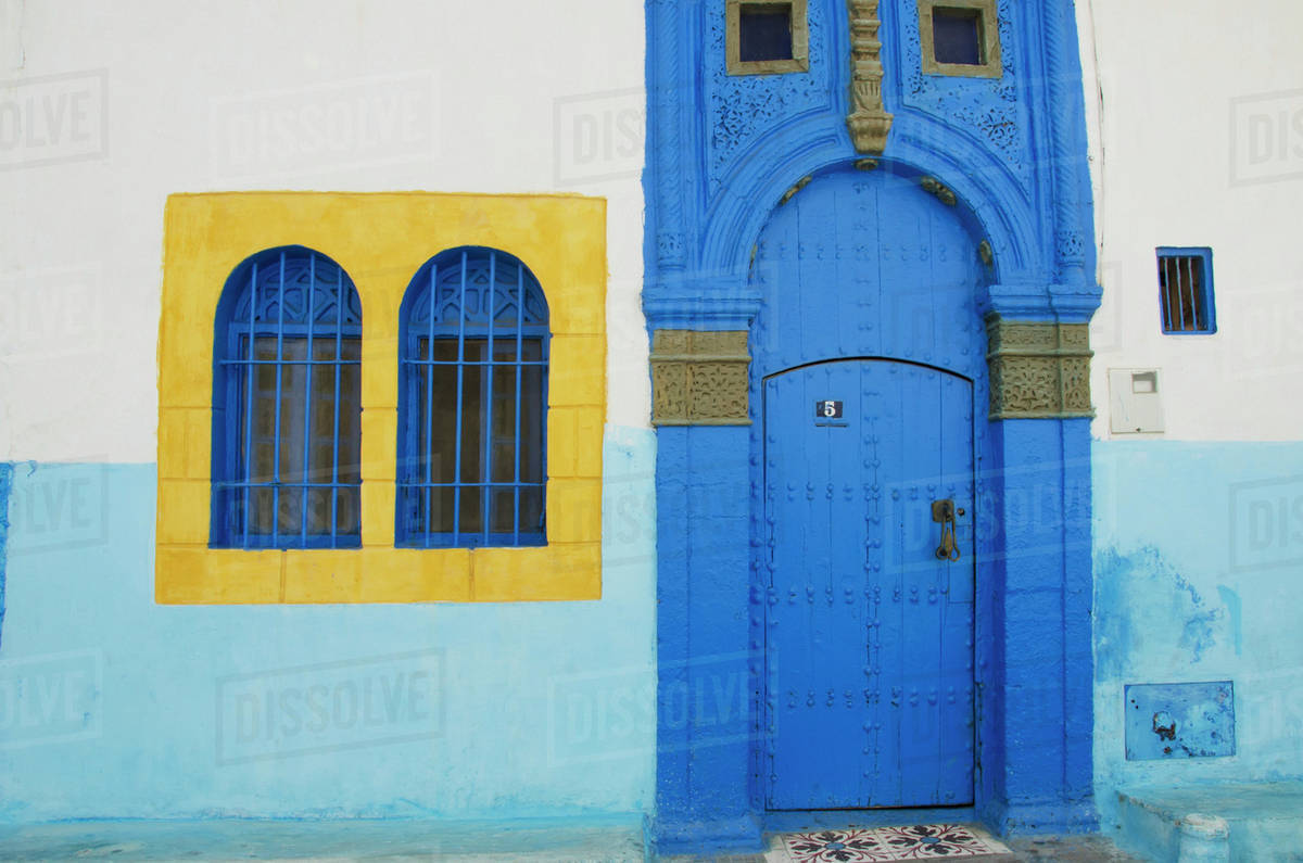 A Painted Blue Door And Bright Yellow Window Frame On House In Old A Painted Blue Door And Bright Yellow Window Frame On House In Old Town Rabat Morocco