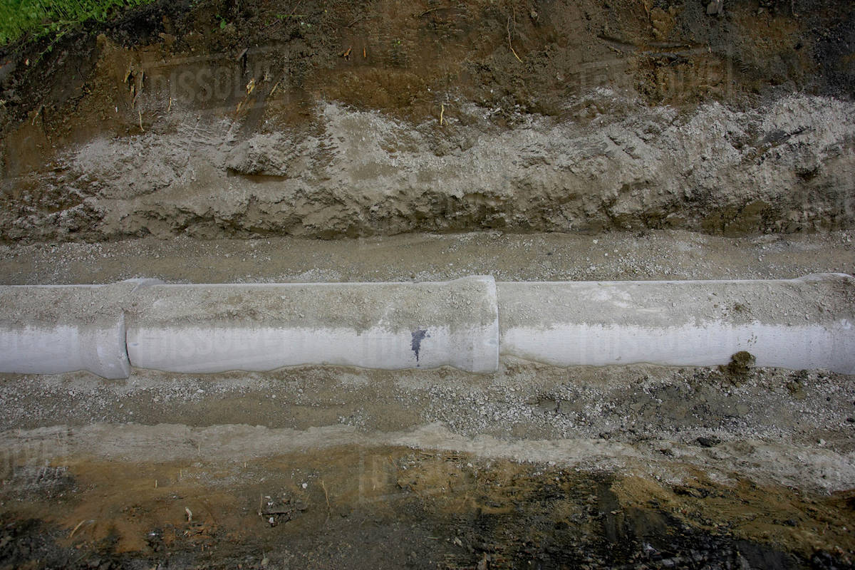Drainage Pipe Half Buried In Earth; Canada, Ontario, Hamilton