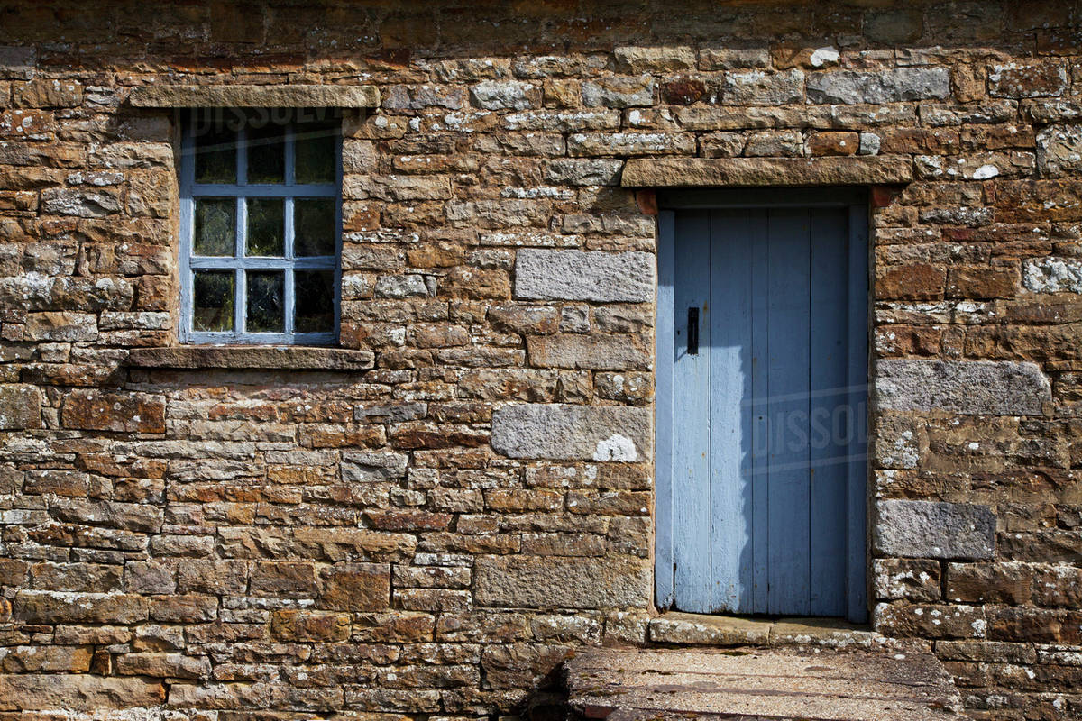 A Blue Painted Door And Window Trim On A Stone Building; Swaledale