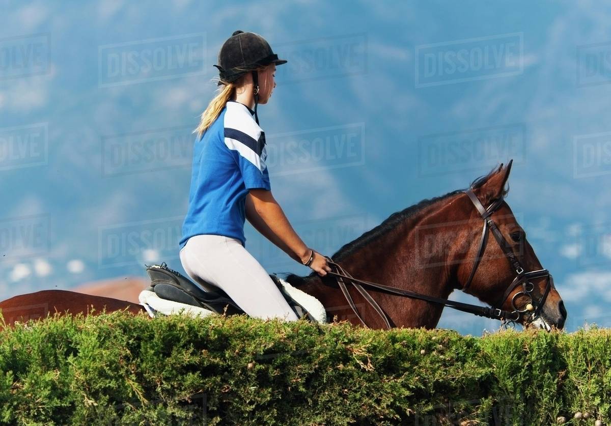 A Girl Riding A Horse; Benalamadena Costa, Malaga, Costa Del Sol, Andalusia, Spain Stock Photo