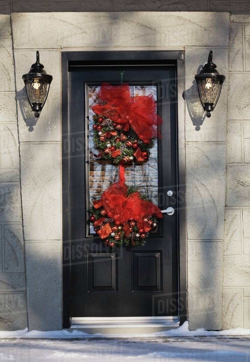 front entrance door on a residential home with christmas decorations in winter quebec canada - Christmas Decorations Canada front entrance door on a residential home with christmas decorations in winter quebec canada - Christmas Decorations Canada