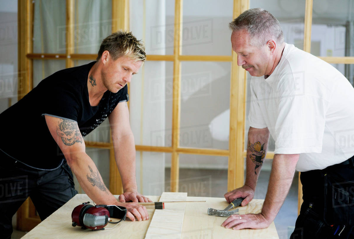 Carpenters working together Stock Photo Dissolve