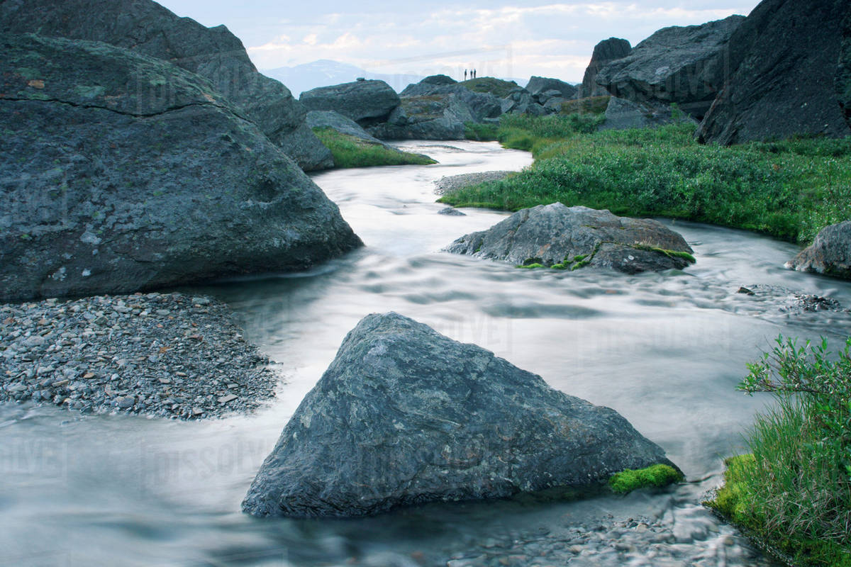 Rapid stream through rocks - Royalty-free Stock Photo | Dissolve