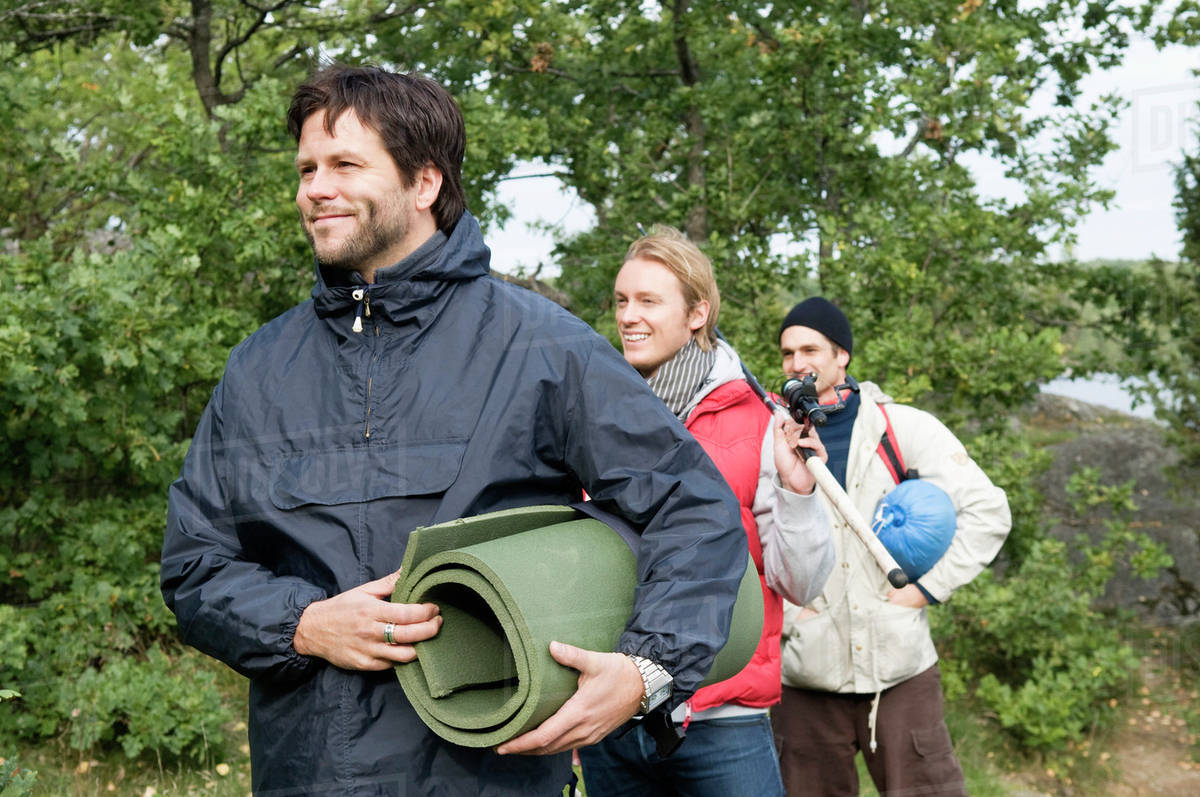 Three guys going camping Stock Photo Dissolve