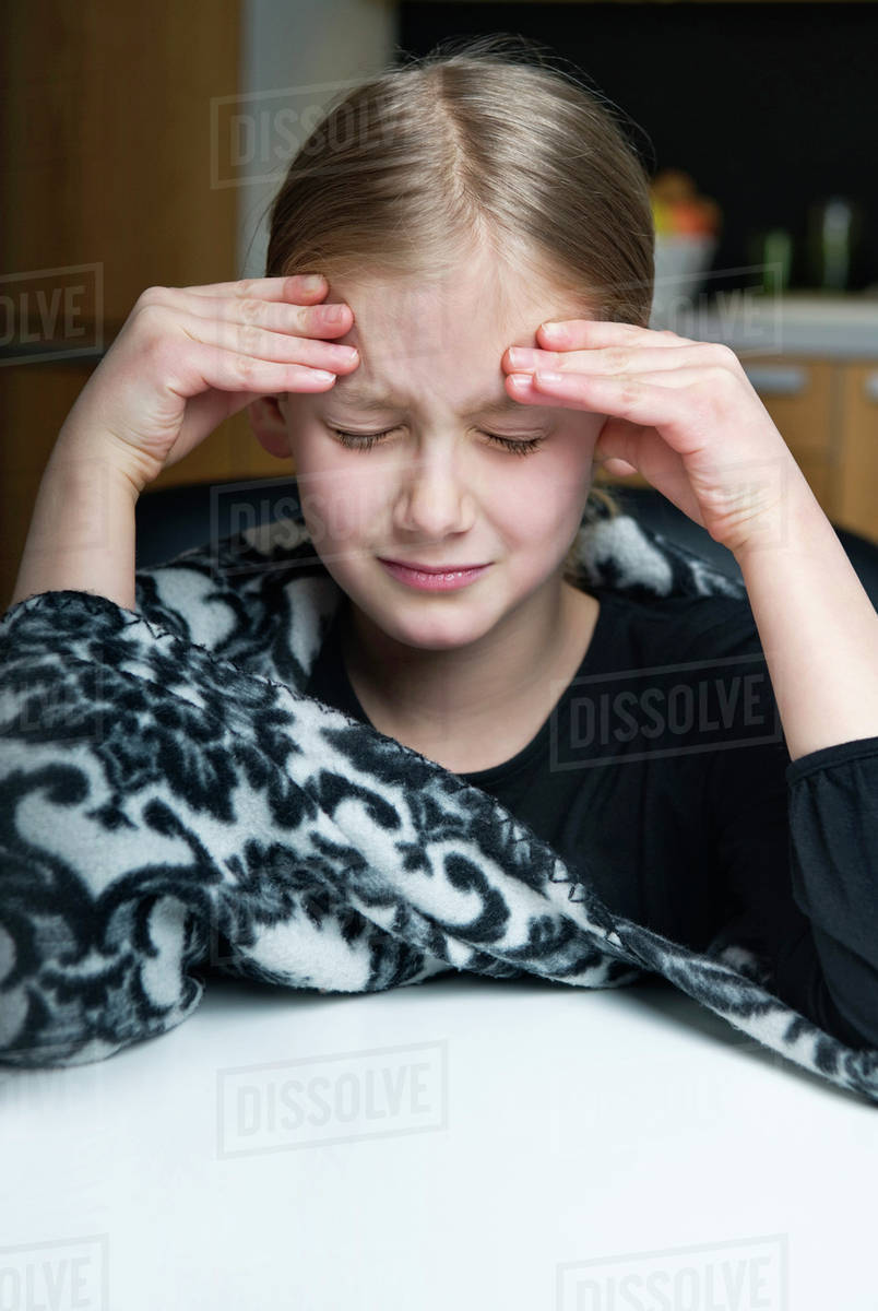 Child with headache Stock Photo Dissolve