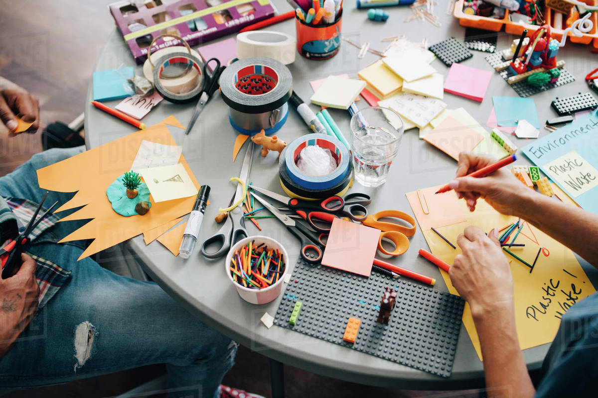 High angle view of colleagues working at table in creative office Royalty-free stock photo