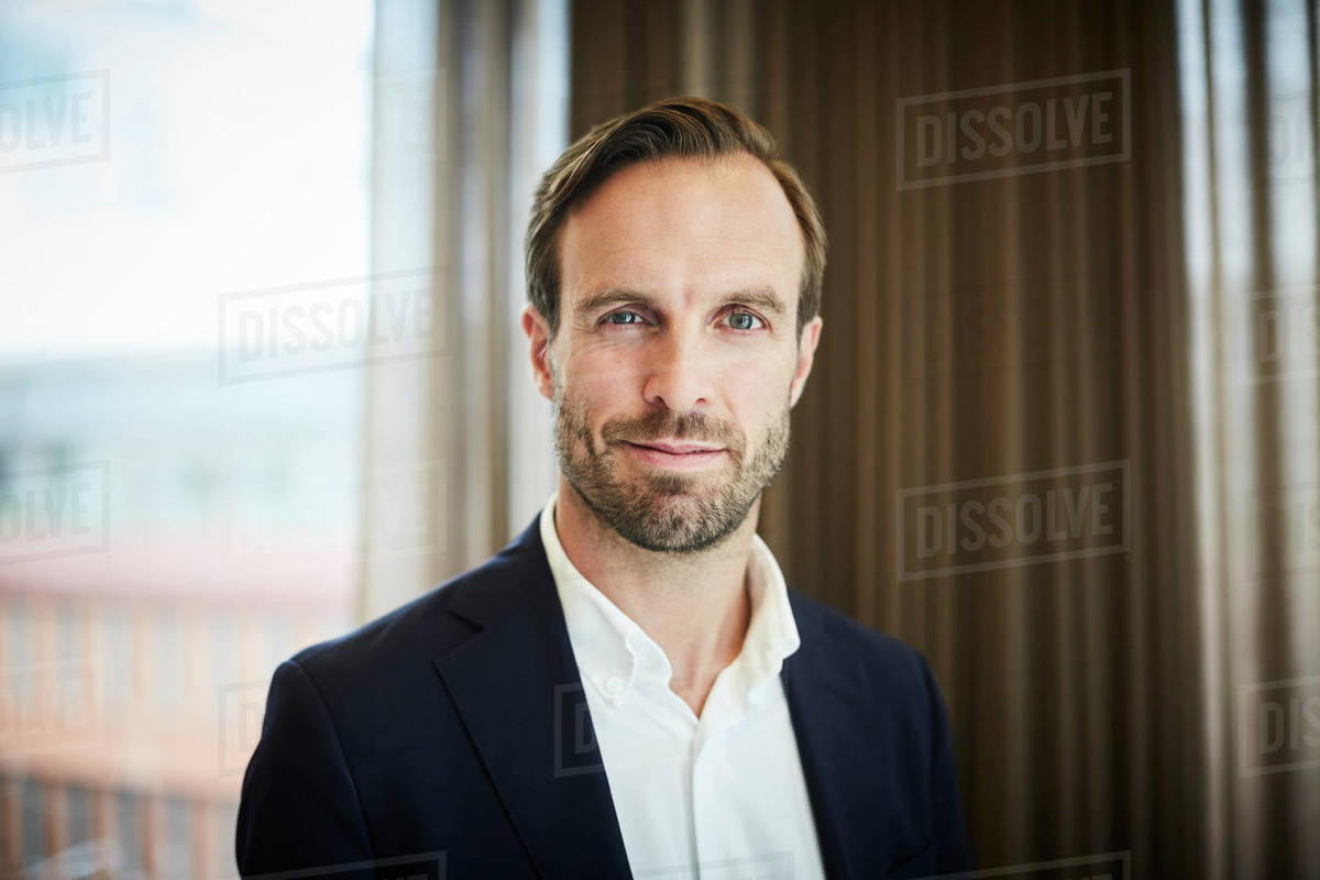 Portrait of male legal advisor in formals at office Stock Photo