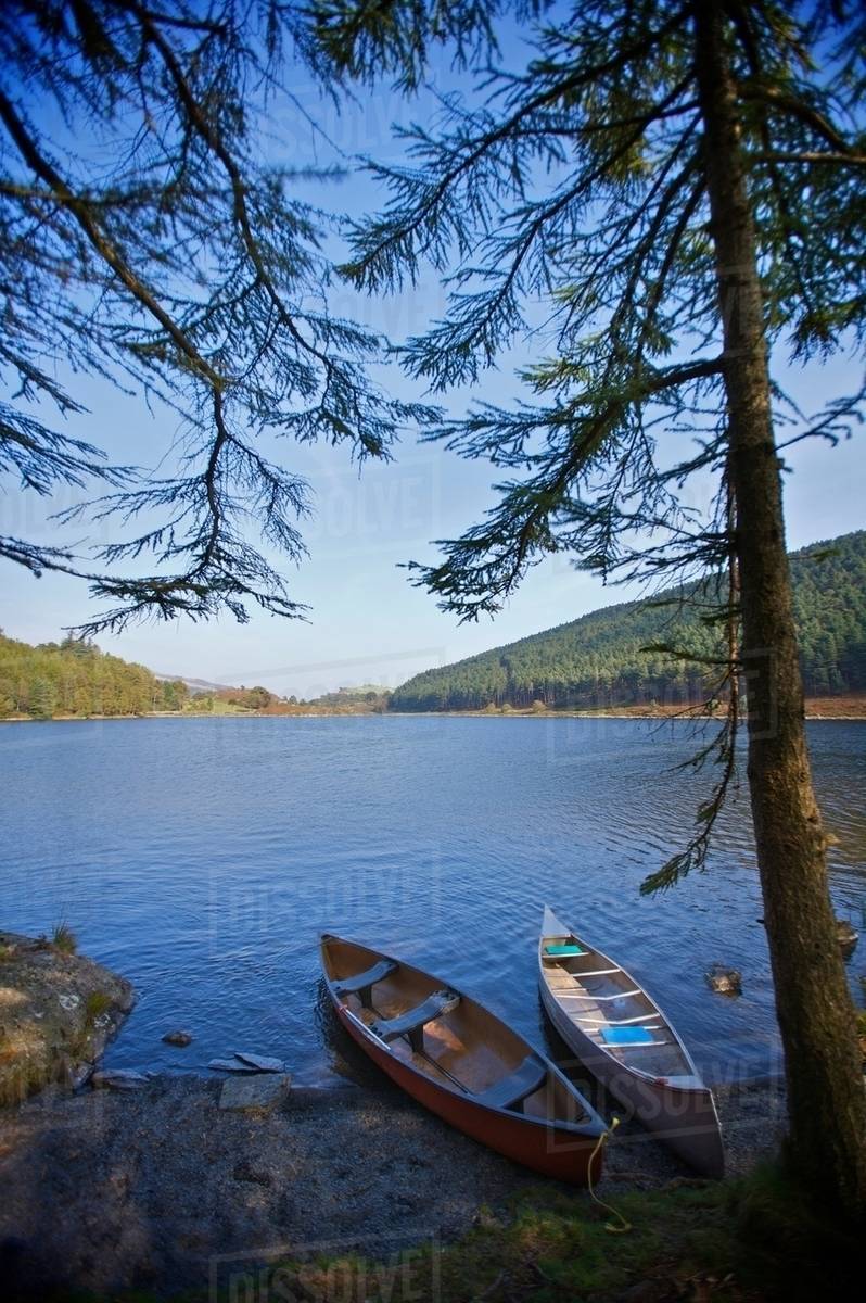 Two kayaks on a lake side. Stock Photo Dissolve