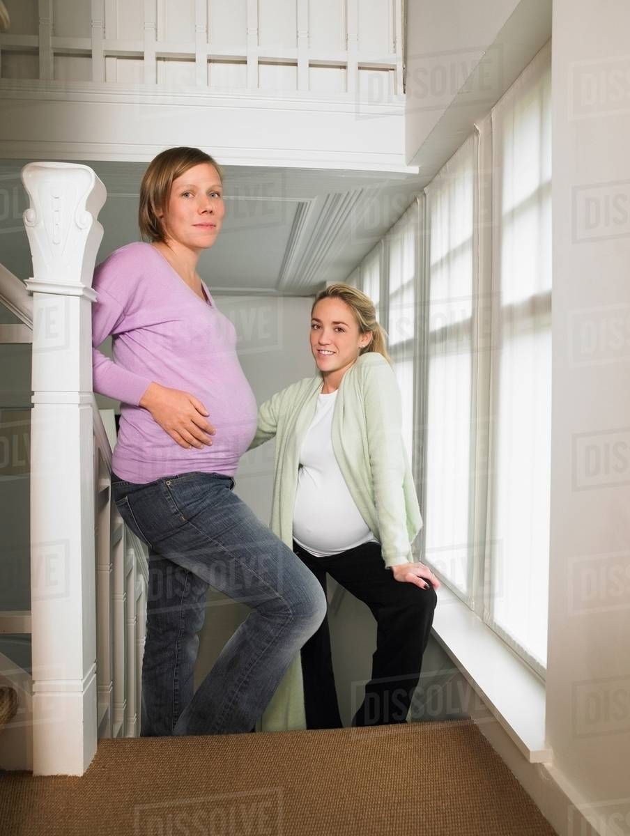 Pregnant women on stairs Stock Photo Dissolve