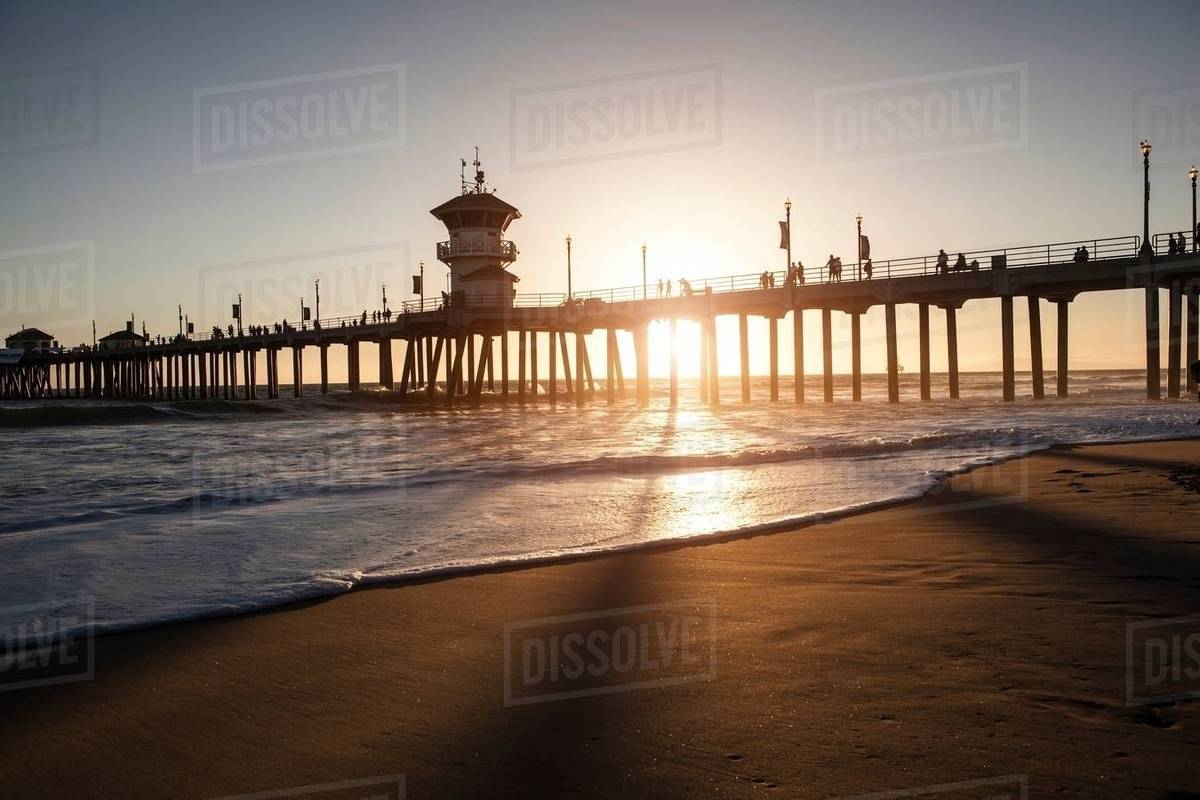 Silhouetted view of pier at sunset, Huntington Beach, California, USA Royalty-free stock photo