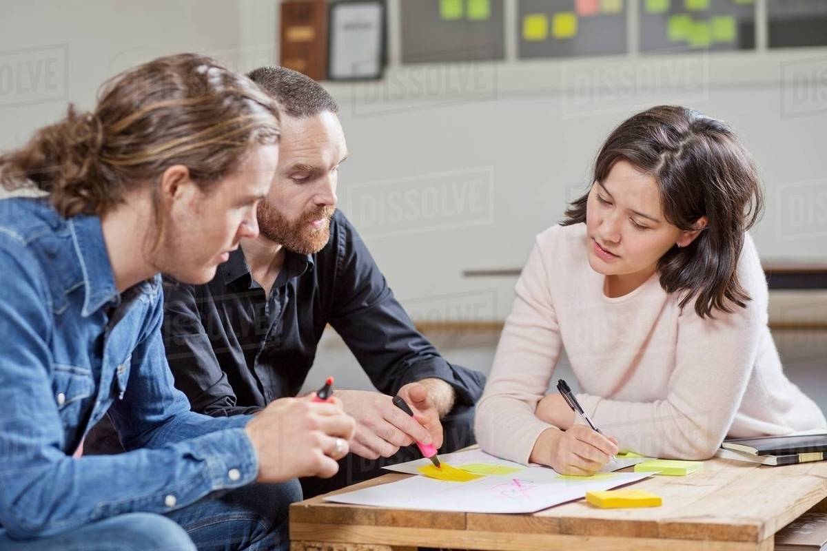 People brainstorming in meeting - Royalty-free Stock Photo | Dissolve