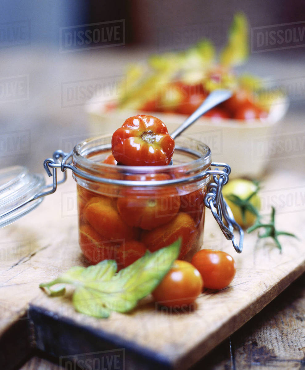 Heritage tomatoes in glass jar Stock Photo Dissolve