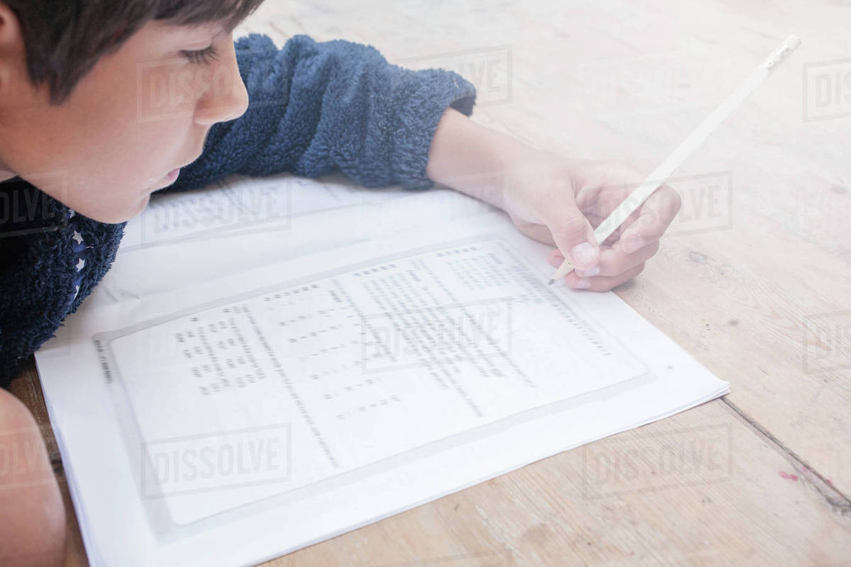 Boy doing maths examination - Royalty-free Stock Photo | Dissolve